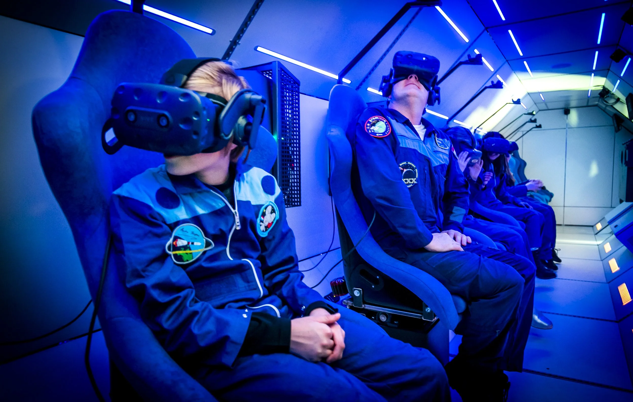 Photo of two people wearing VR headsets