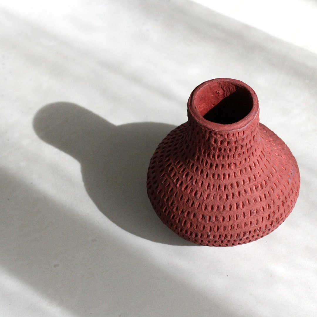 Sculptural... Lightweight... Handcrafted... Shatterproof... oh, and made from Cotton Waste from the Fashion industry.

This is our Cotton Stone&trade; Gourd Vase, in Rust.

We think it&rsquo;s beautiful just the way it is, but with flowers... stunnin