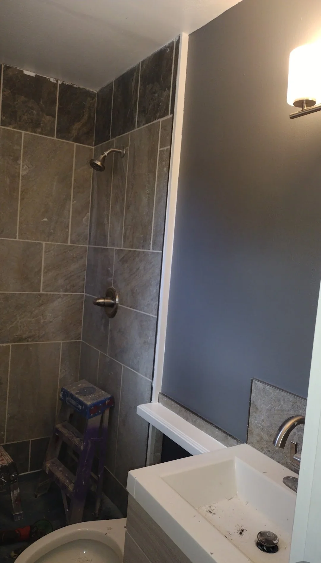 Unifinished ceiling bathroom oh up tile done.jpg
