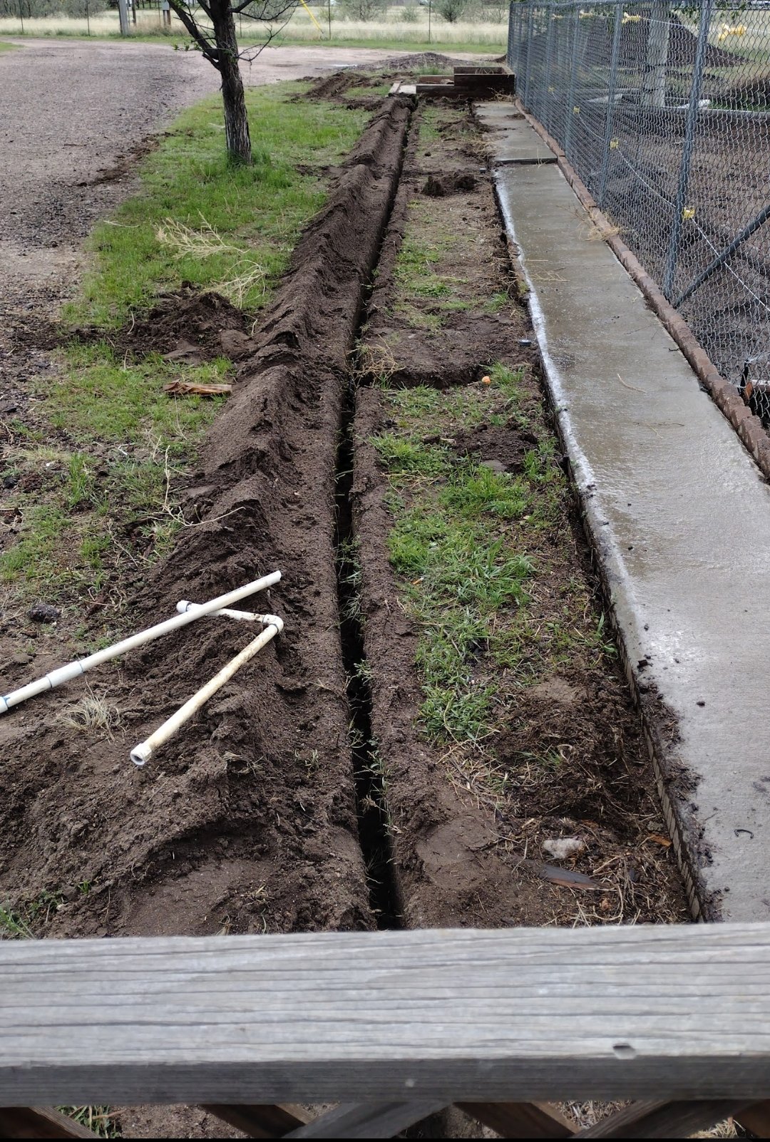 Tom dirt side of house.jpg