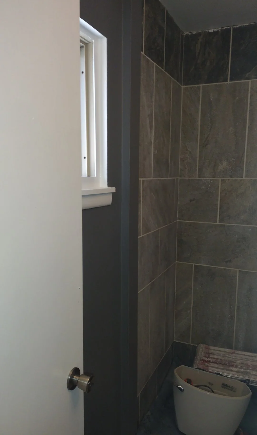 window in bathroom shows done trim OH UL.jpg