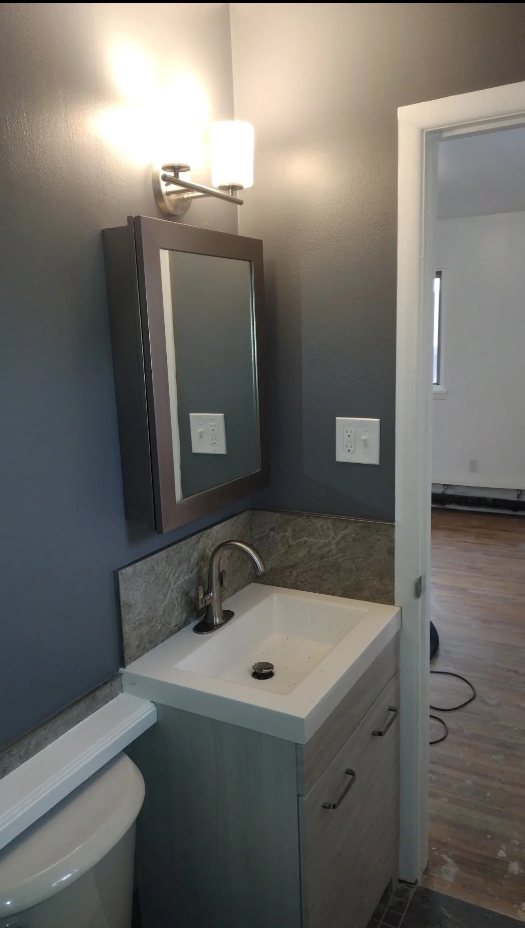 Finished bathroom med cab UL OH.jpg