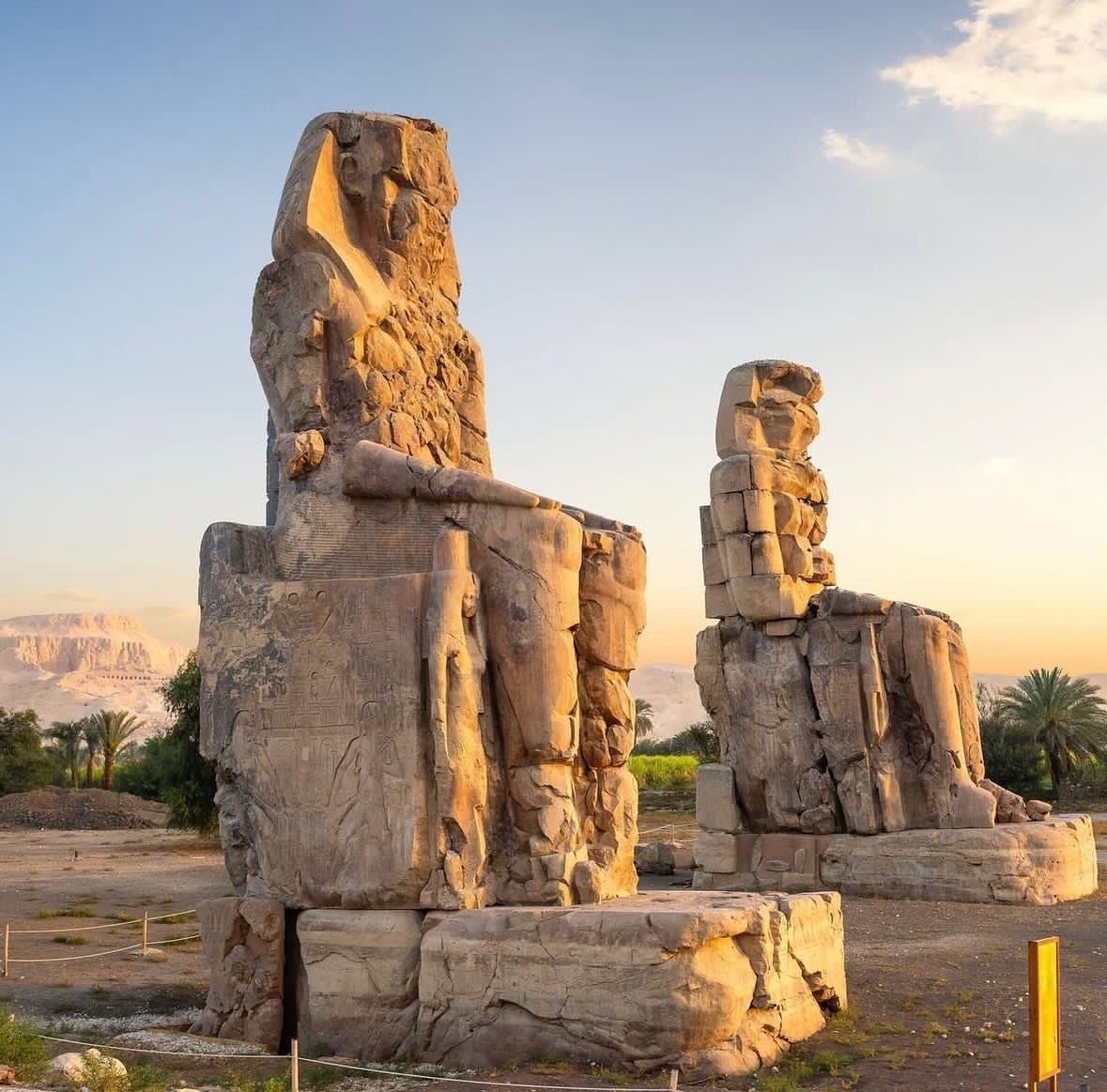 The Colossi of Memnon, representing King Amenhotep III, once stood in front of the pylon gates of his mortuary temple in the West Bank of Luxor. 

The temple was the largest temple in the Theban Necropolis. An earthquake in ancient times destroyed th