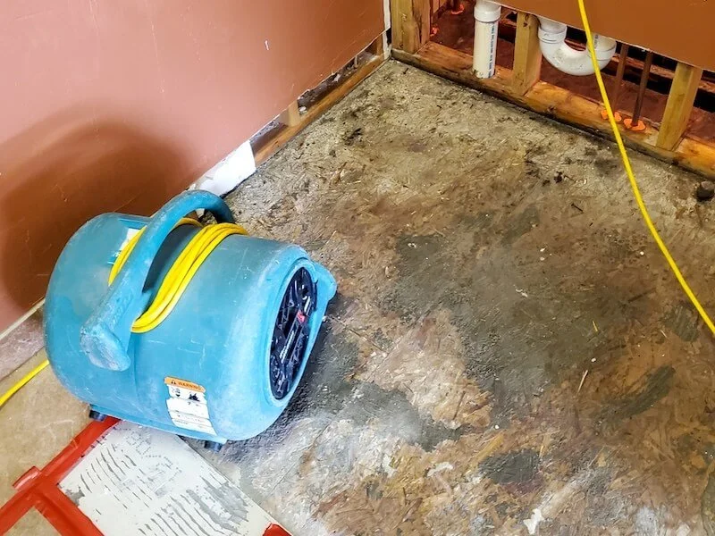 Industrial dryer drying water damaged floor and wall