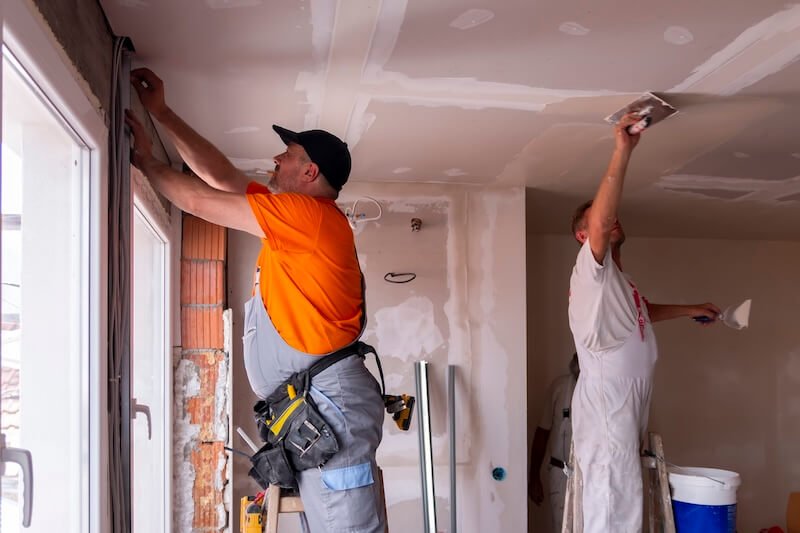 Professional Restoration Experts working on an apartment renovation after water damage