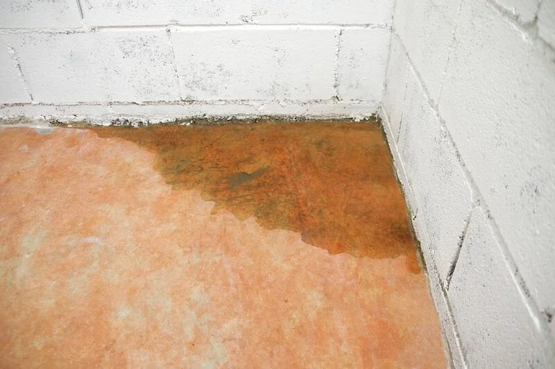 Water building up in the corner of a home's basement