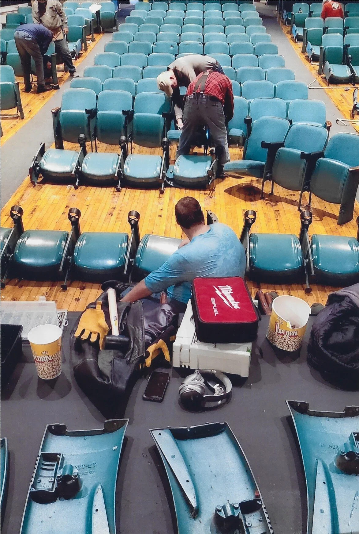 Picture from the stage of auditorium of original seating being removed from the auditorium.
