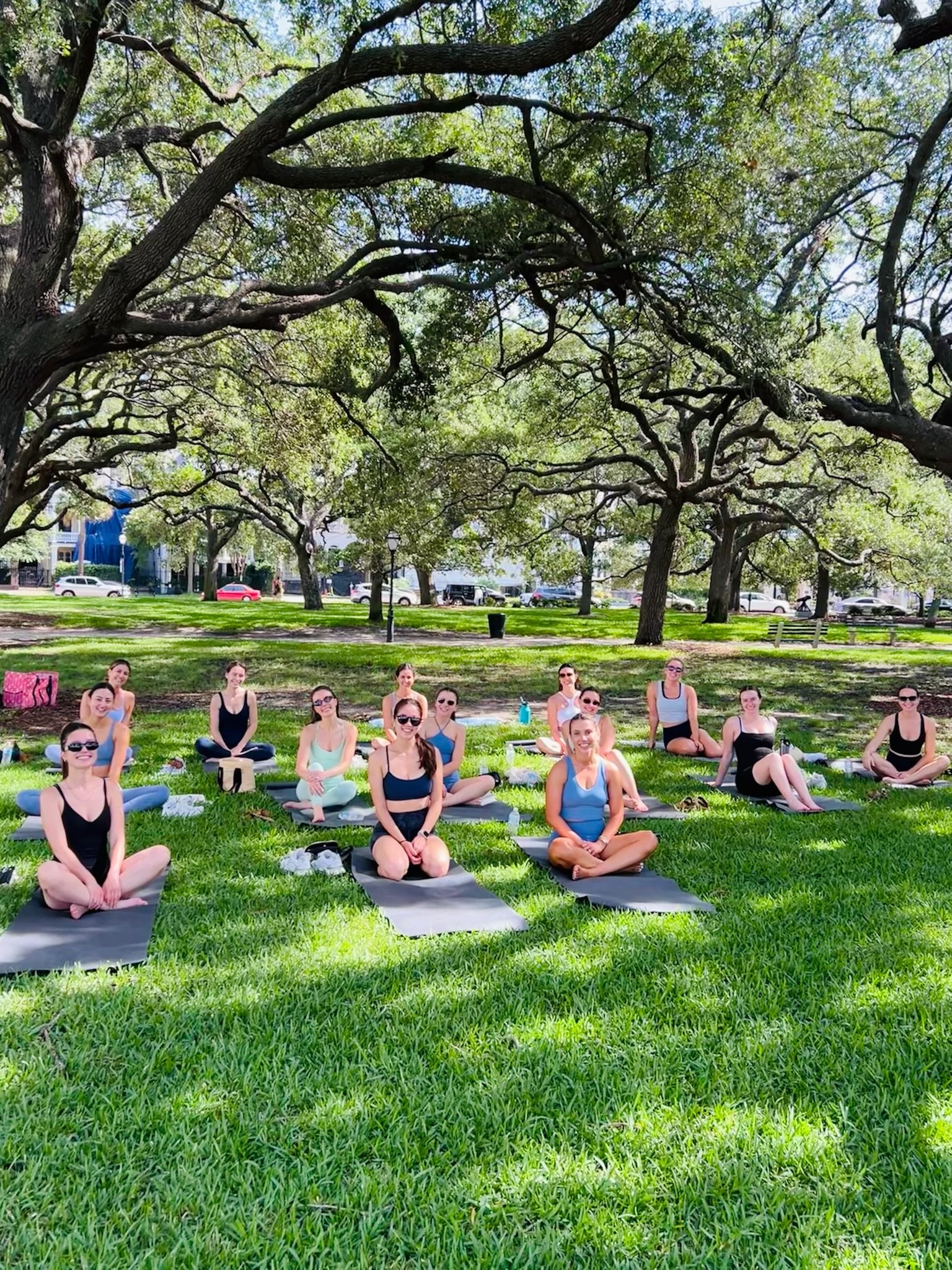 Private yoga group in Charleston at White Point Gardens for a destination celebration.