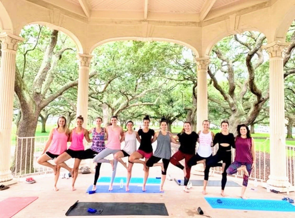 Private yoga session in a Charleston park