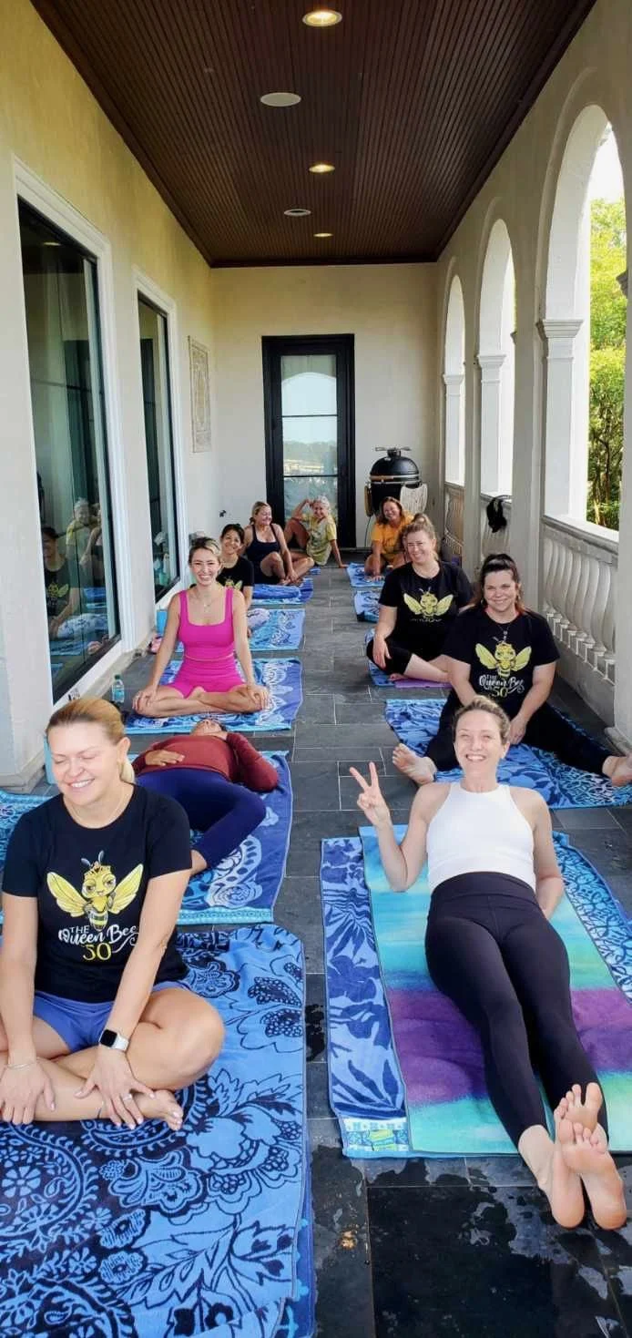 Friends celebrating a birthday with a private yoga session at their Charleston vacation rental.