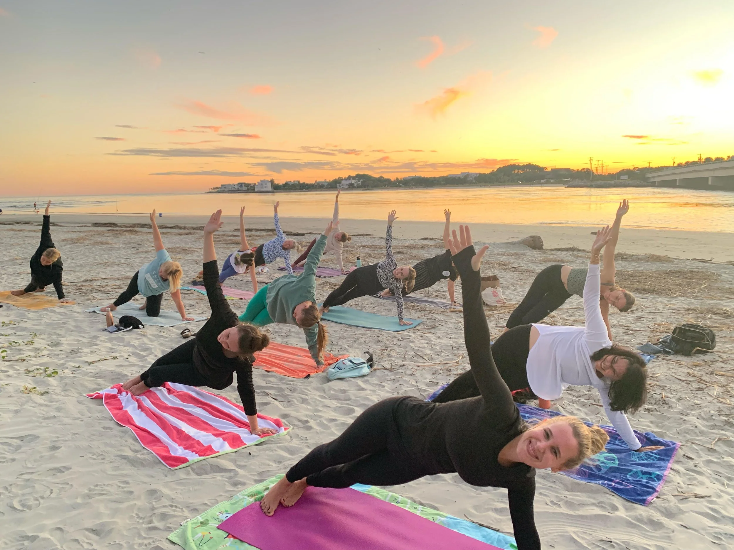 Sunset yoga class at Breach Inlet on Isle of Palms near Charleston, South Carolina.