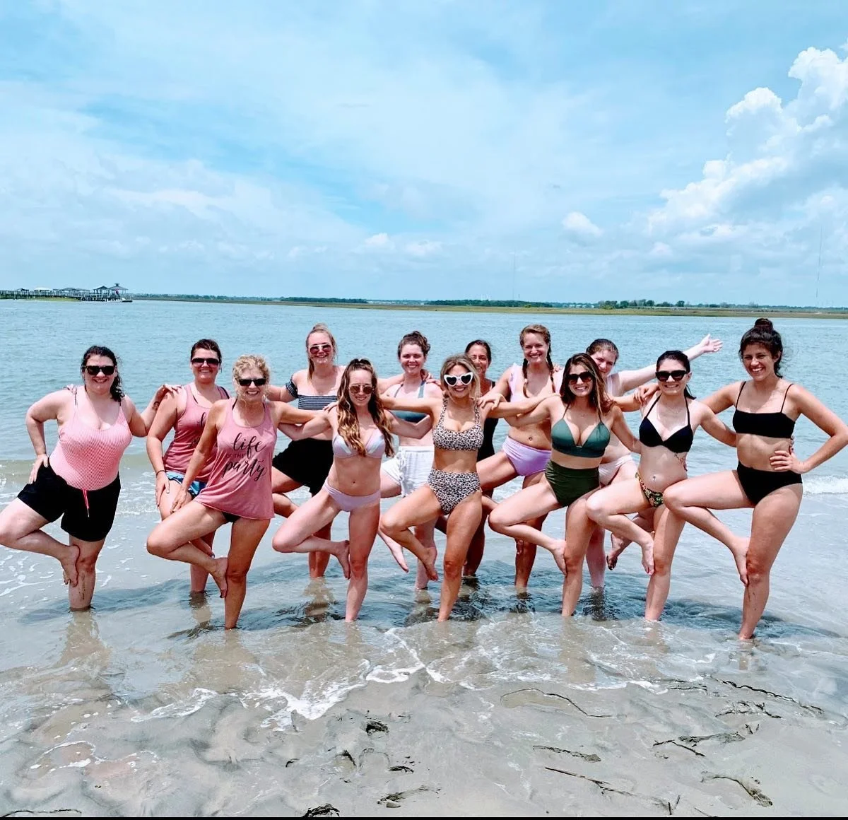 Beach yoga for brides and bridesmaids during a Charleston bachelorette getaway on Isle of Palms near Charleston, South Carolina. 