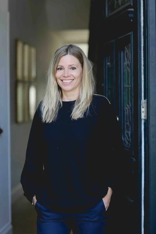 NUTRITIONIST in front of london door way looking philosophical
