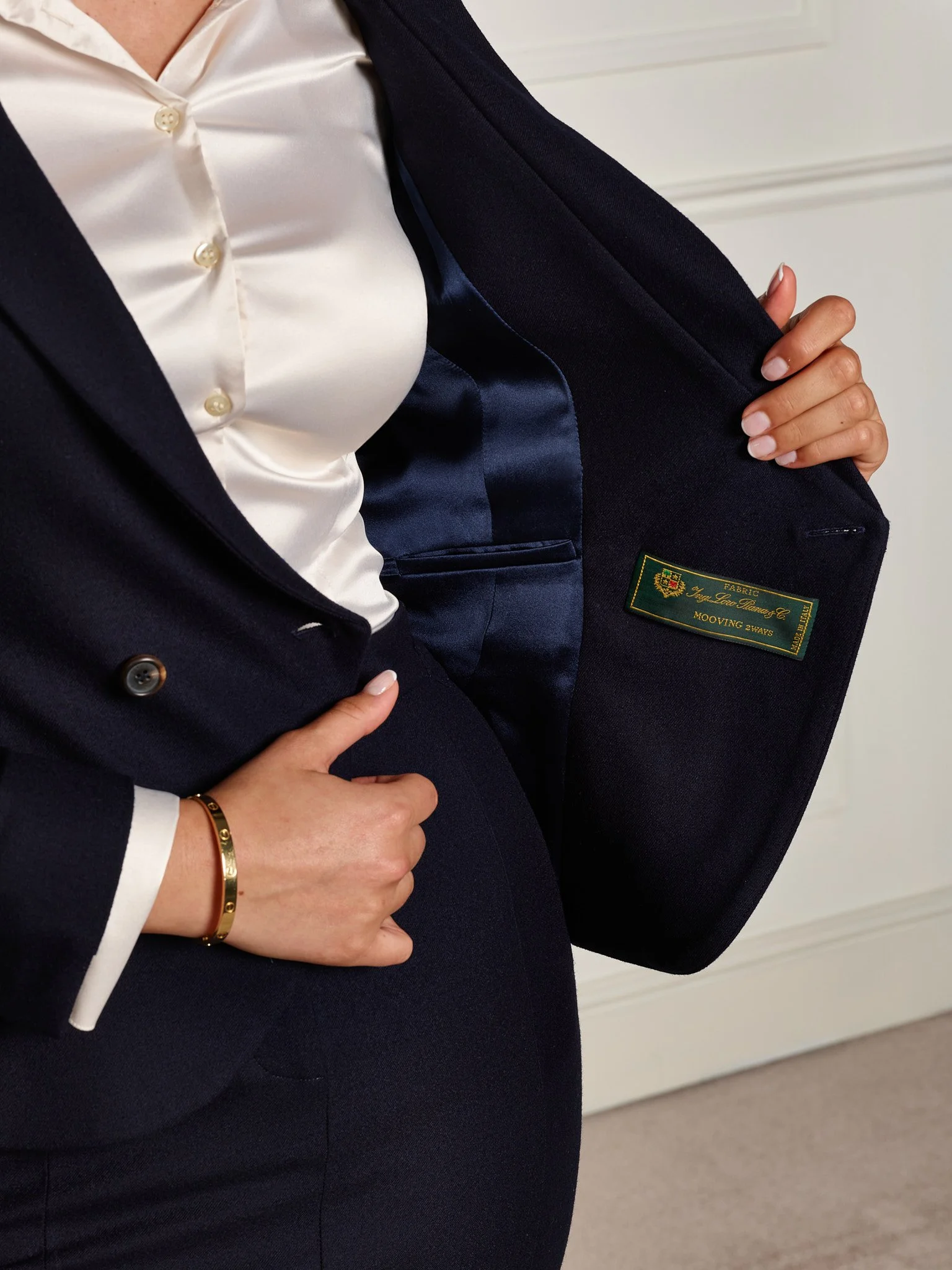 Interior pocket detail of navy wool women’s tailored blazer designed to fit an iPhone Pro Max