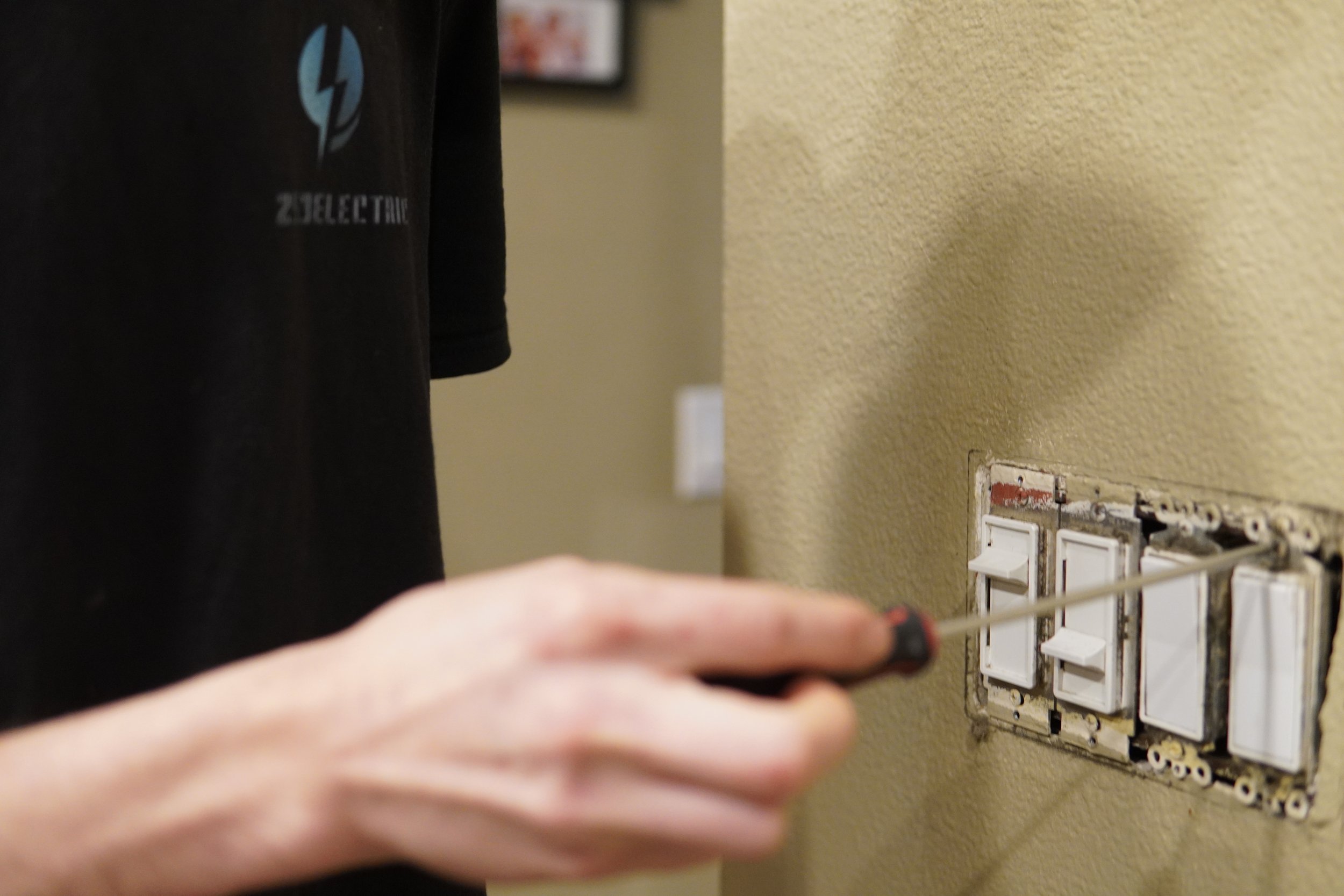electrician replacing light switches