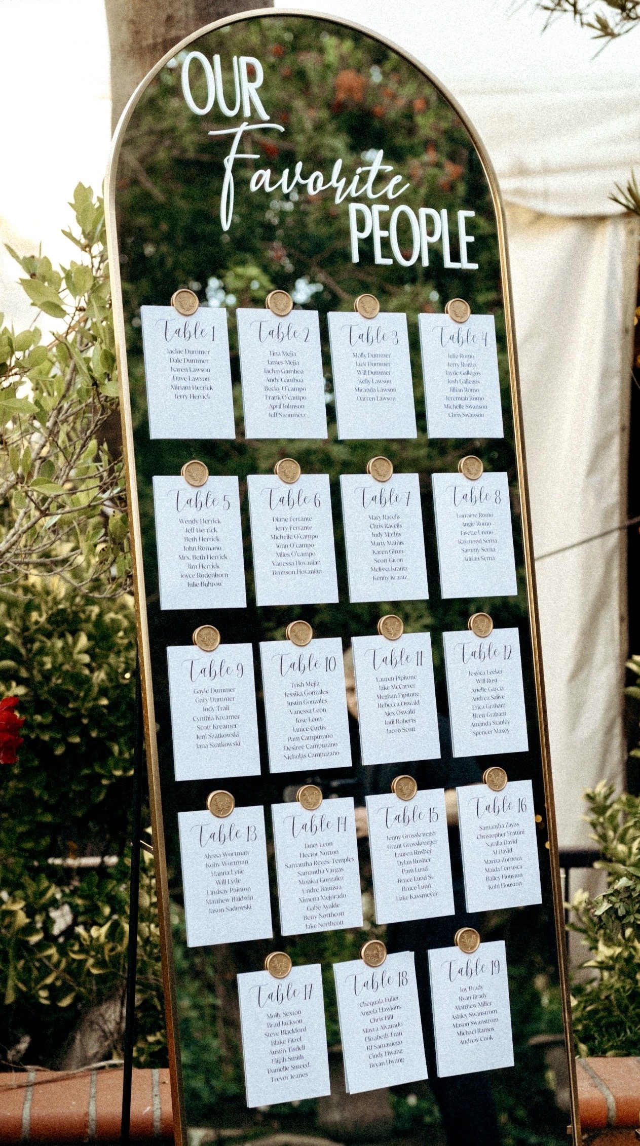 Printed table seating chart cards on white cardstock with gold wax seal