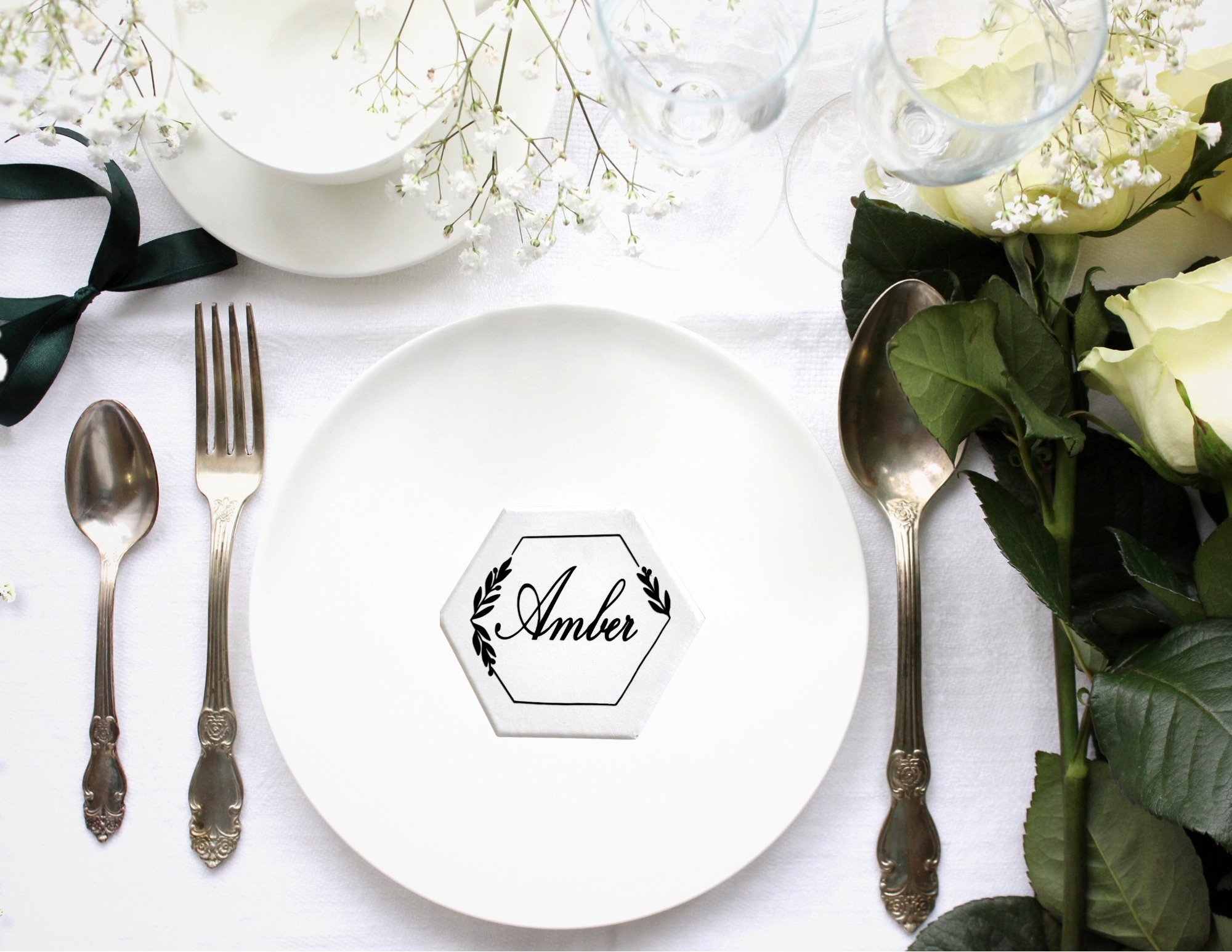 Personalized tile coaster place cards displaying guest names for wedding seating arrangements