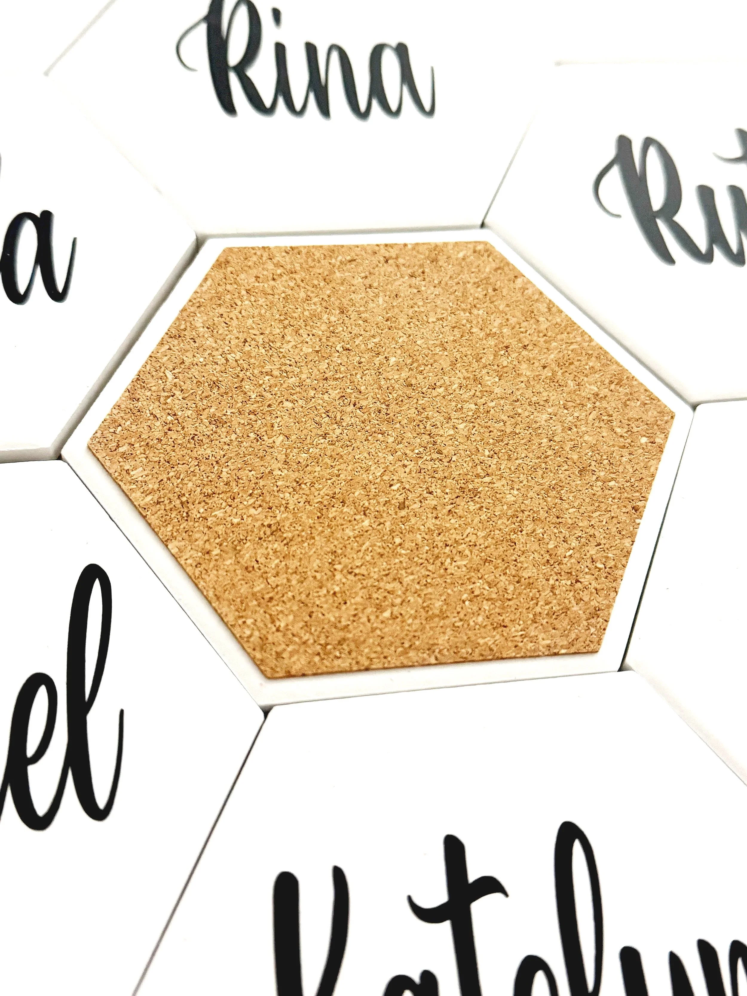Ceramic coasters that double as elegant wedding favors and personalized place cards — a stylish, functional detail your guests will love and keep.