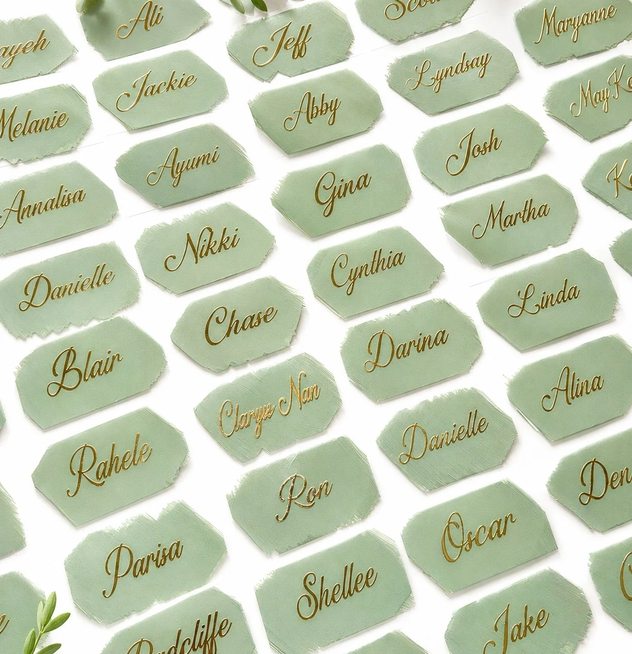 Painted acrylic wedding place cards with personalized names sage green
