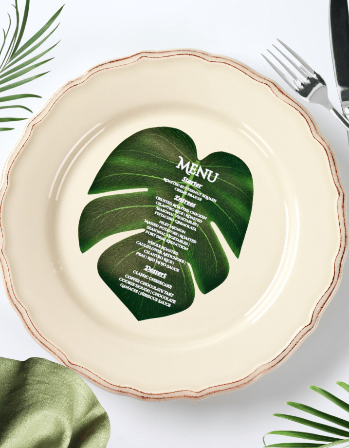 Faux Green Monstera Leaf used as a dinner menu printed in white text