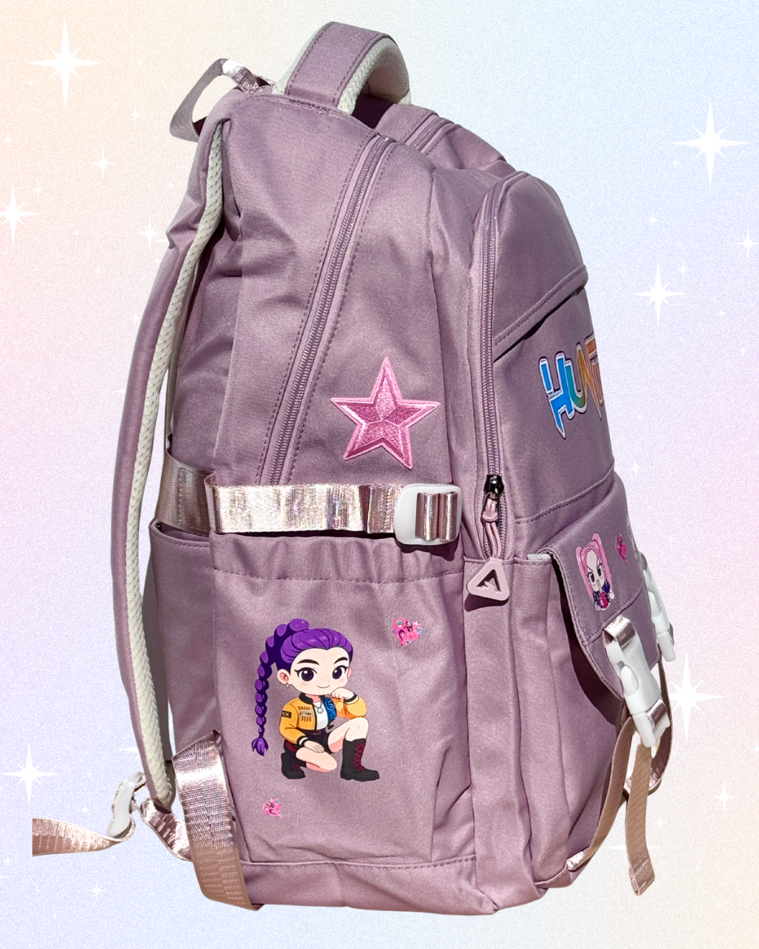 Huntrix girls dusky pink K-Pop Demon Hunters school backpack with laptop compartment, anti-theft back pocket, and multiple storage pockets.