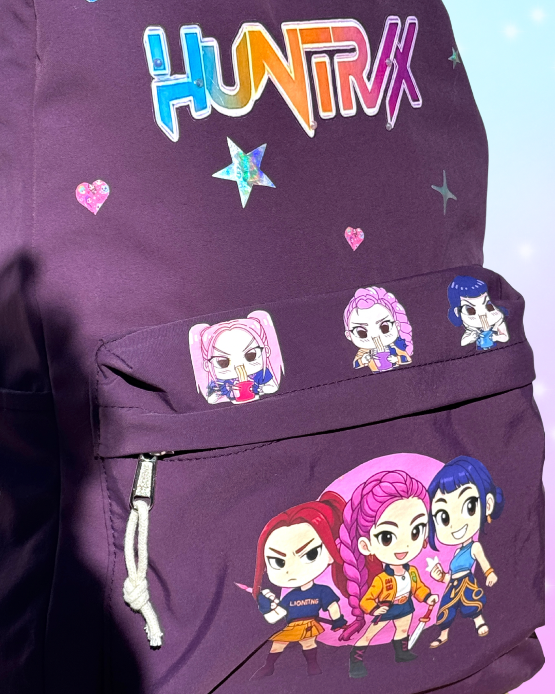 Huntrix K-Pop Demon Hunters purple school backpack with three compartments and padded straps, perfect for students and fans in San Diego.