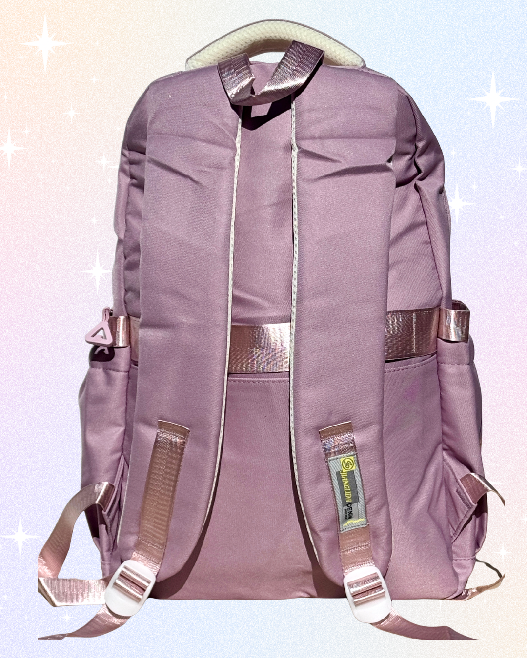 Huntrix girls dusky pink K-Pop Demon Hunters school backpack with laptop compartment, anti-theft back pocket, and multiple storage pockets.