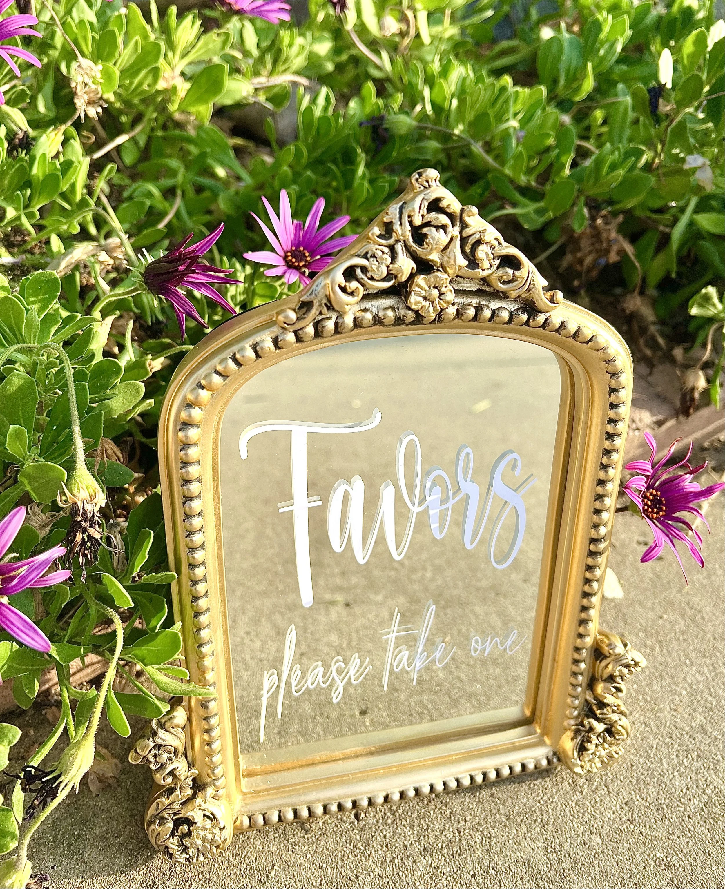 Elevate your wedding reception with our stunning gold wedding mirror signs. Crafted with exquisite detail and vintage charm, this elegant piece adds a touch of sophistication to your celebration. We have a variety of signs to choose from such as card