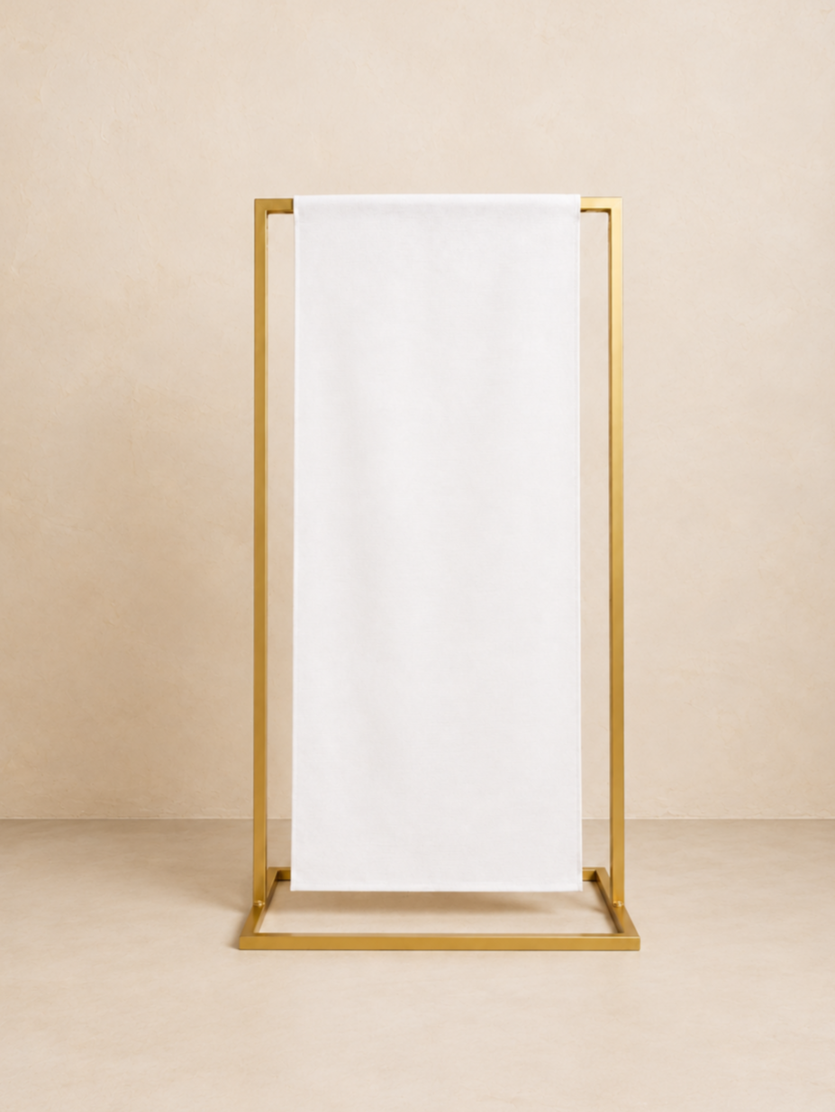 Personalized fabric wedding welcome sign elegantly displayed on a classic gold stand.