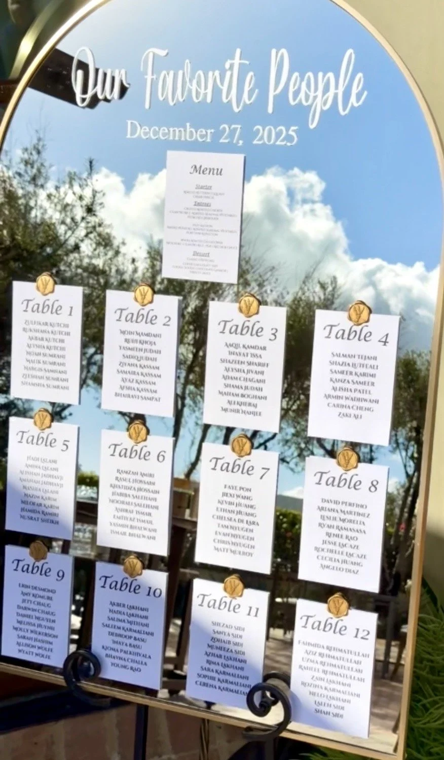 Printed table seating chart cards on white cardstock with gold wax seal