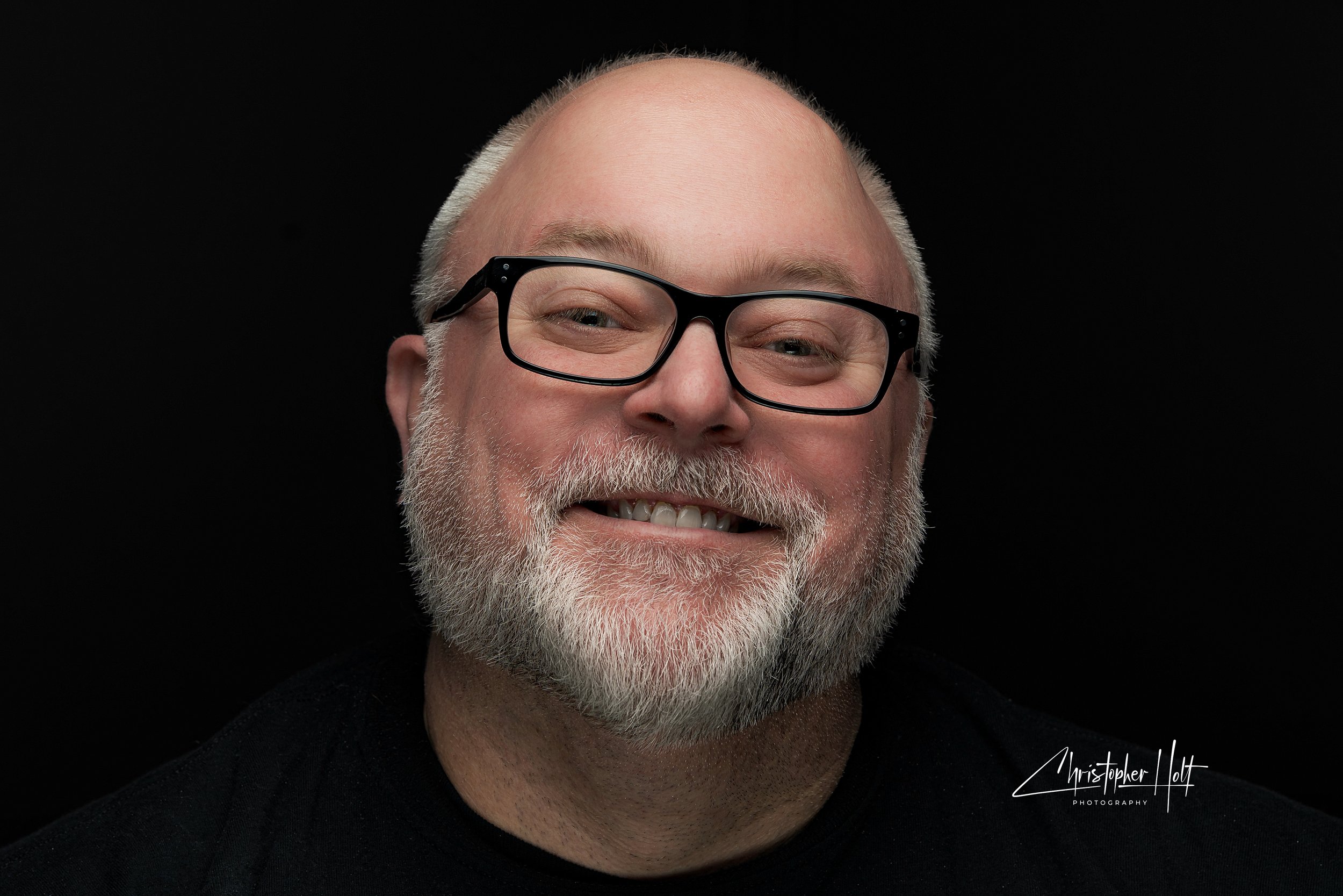 chris portrait with branding.jpg