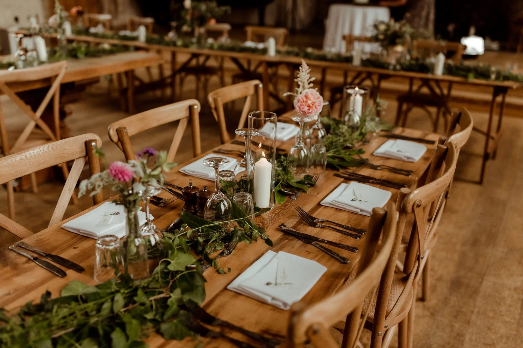 Devon-grown organic flower table runner arrangement on traditional wooden table with chairs