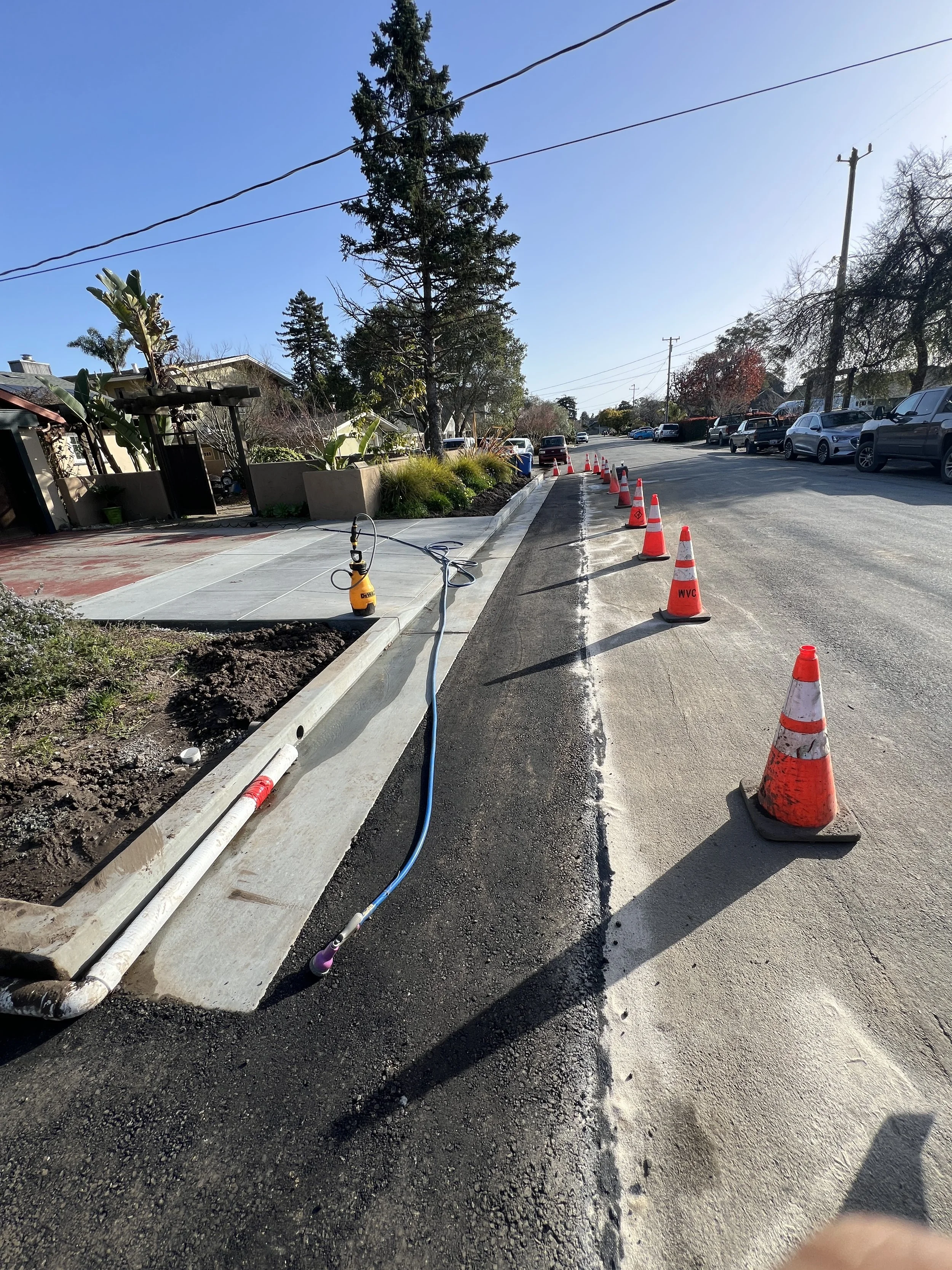 New concrete curb, gutter and sidewalk along a public street