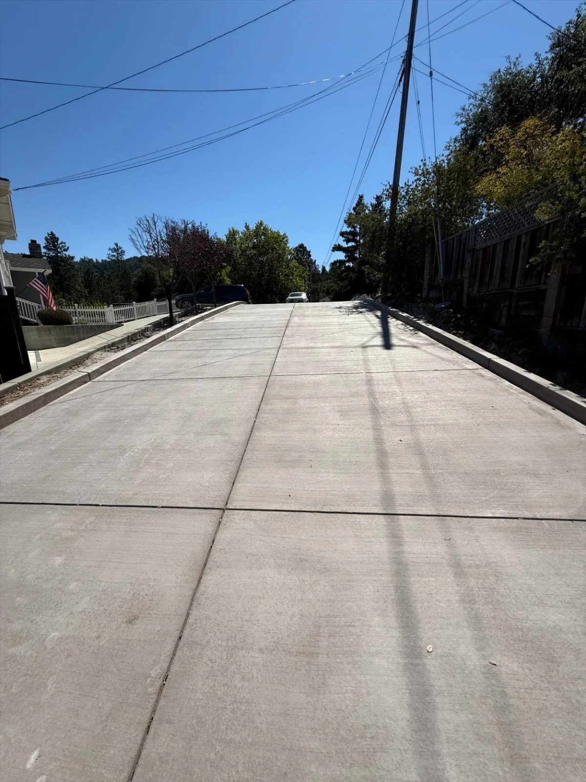 New concrete road and curb installed by Freedom Earthworks in Santa Cruz County