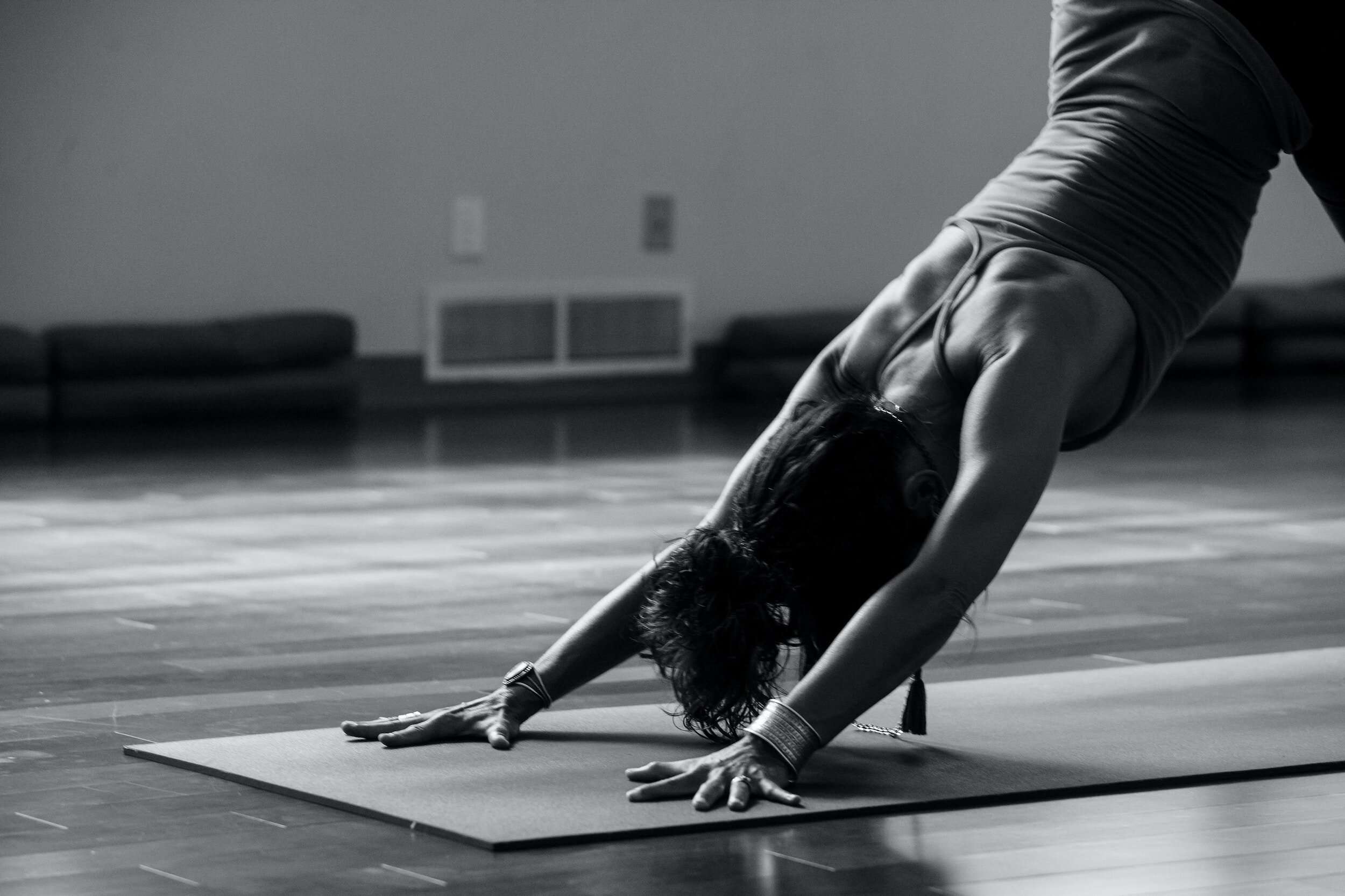 a woman practicing yoga and self-care during her luteal phase before the arrival of her period