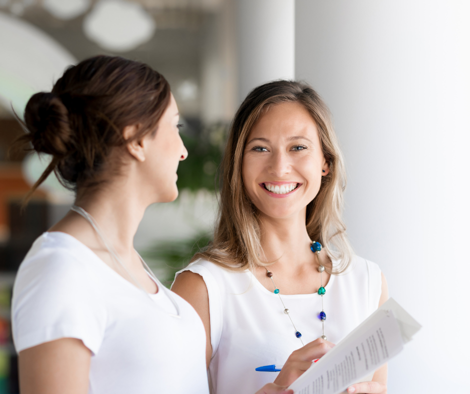 Two professional young women smiling