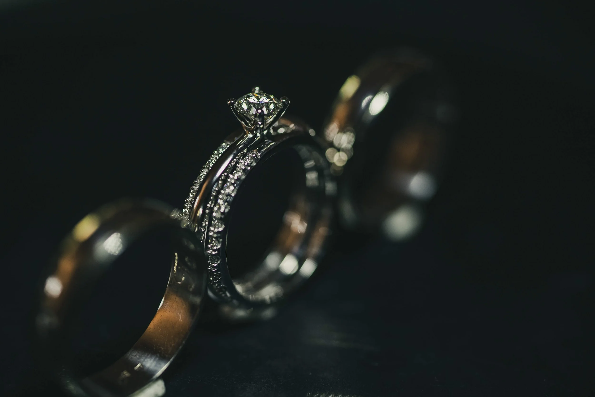 Wedding rings and bands macro detail shot for Oscar and Michaela Calgary wedding