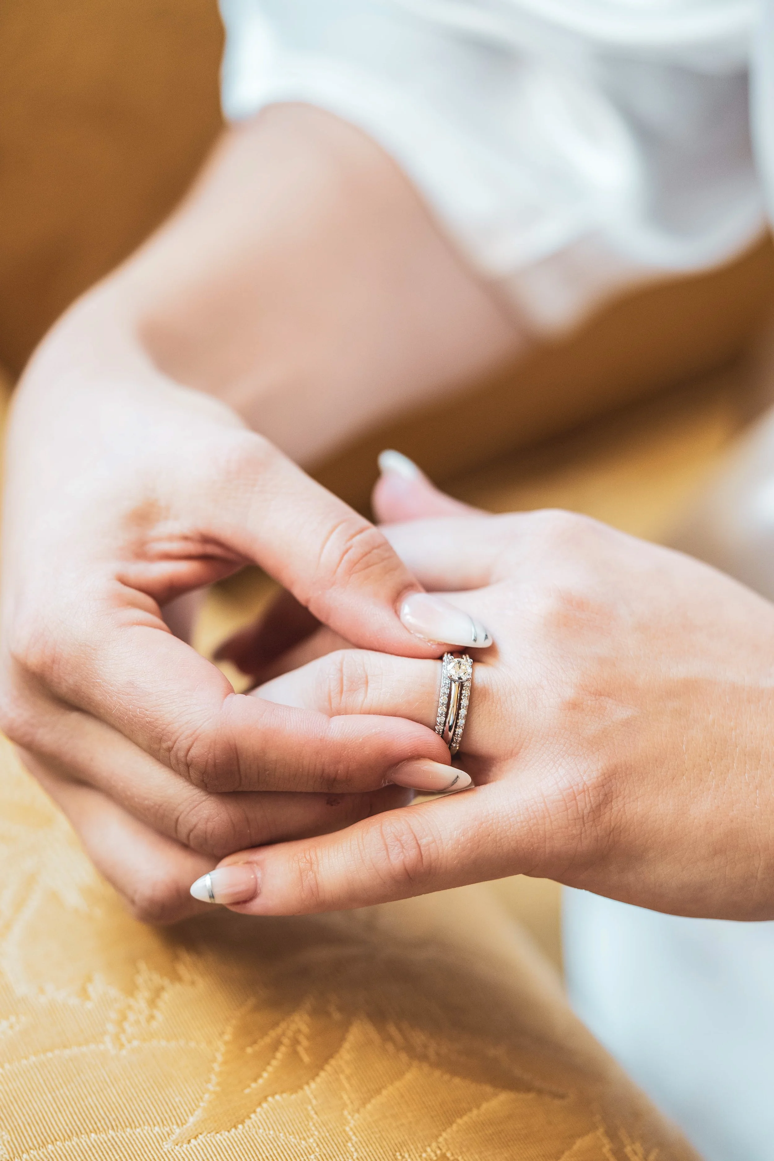 Close up of bride Michaela holding her wedding rings during getting ready Calgary