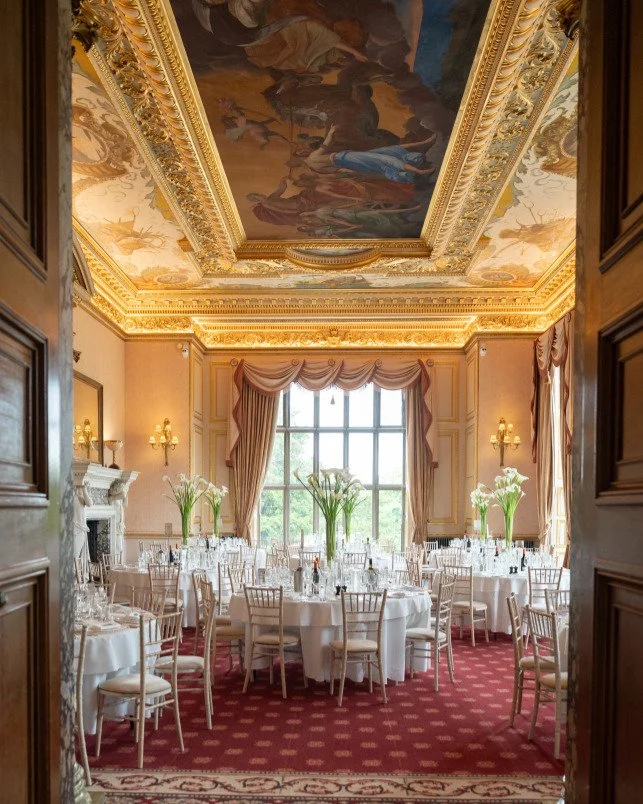 A suite of subtle storytelling.

For Tara and Drew&rsquo;s wedding at Ashridge House, the table plan was more than a guide for guests. Inspired by the gilded ceiling of the Lady Marian Alford Room and the richly embossed covers of antique books, it p