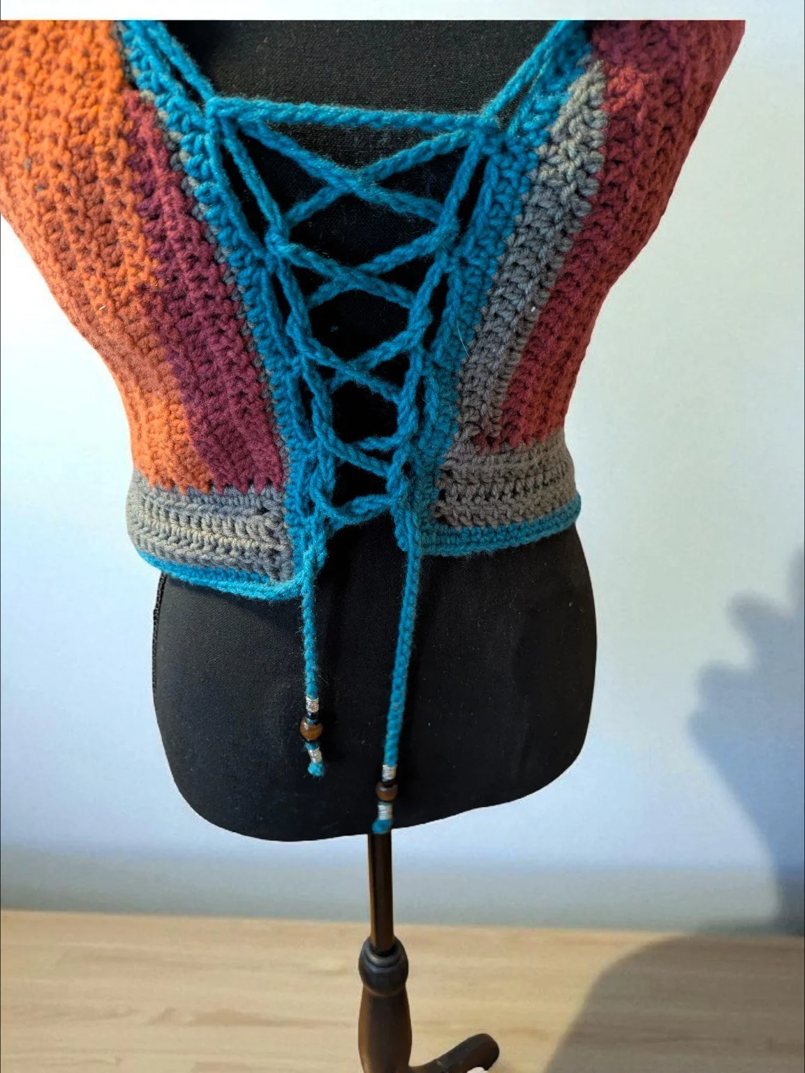 hooded-mandala-vest-lace-up-detail.jpg