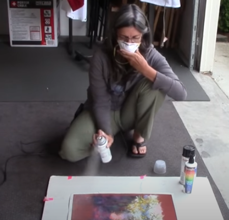 Marla Baggetta spraying fixative