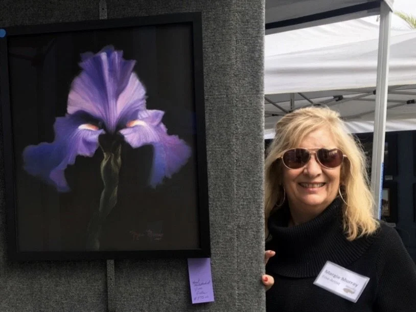 Headshot of Margie Murray with iris painting