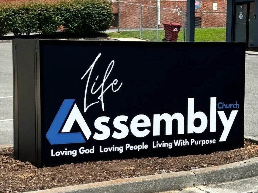 Custom double sided sign cabinet utilized as a monument sign for Life Assembly Church.