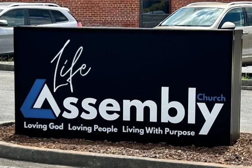 Custom double sided sign cabinet utilized as a monument sign for Life Assembly Church.