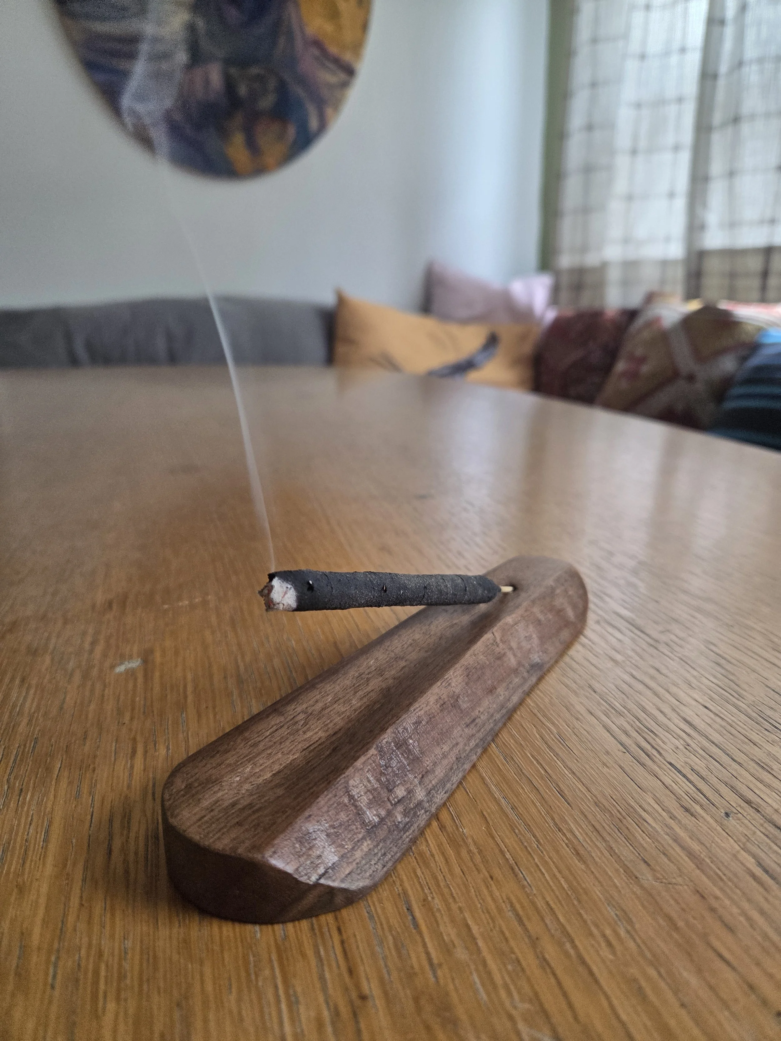 small incense holder made from a piece of cut off walnut