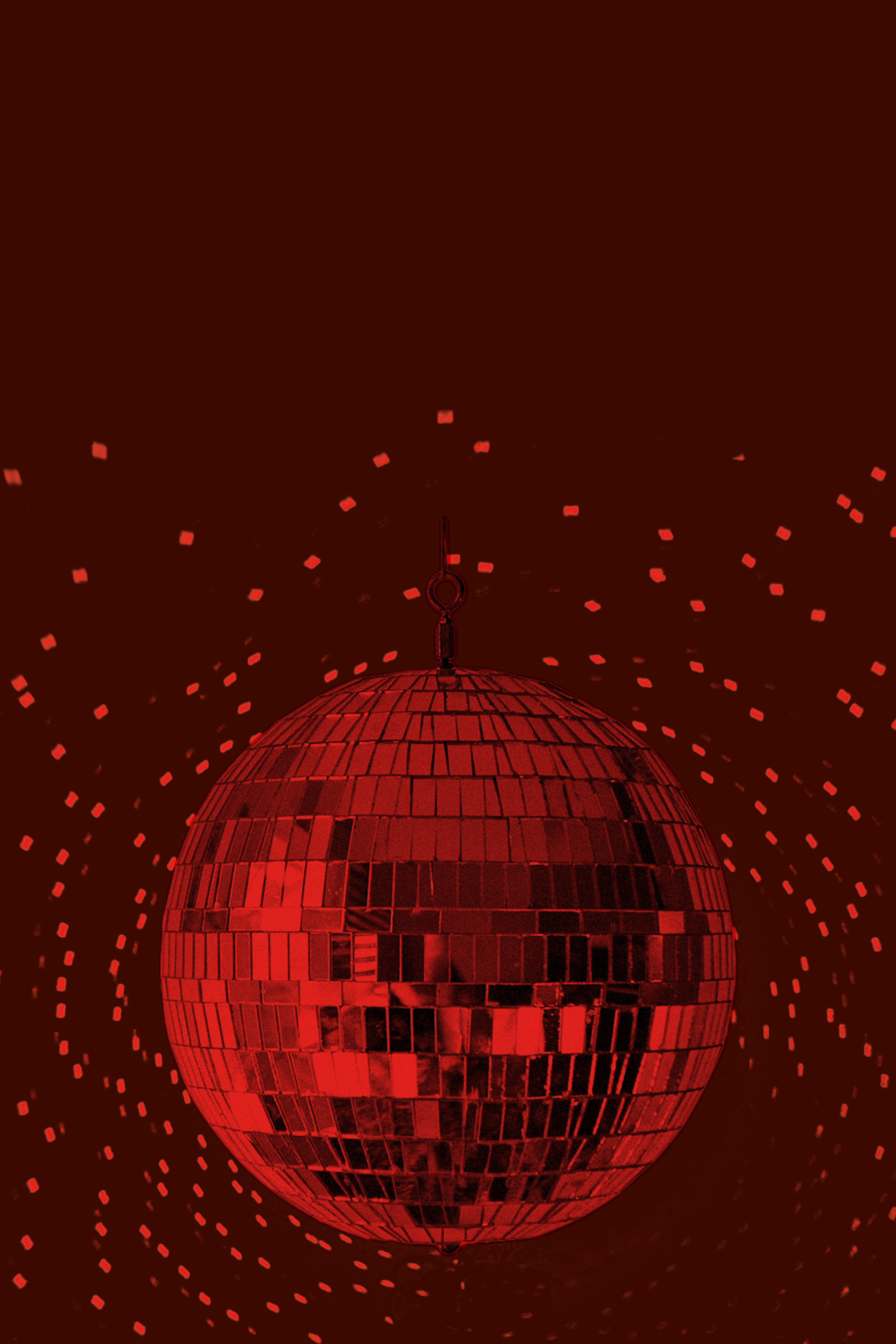 A red disco ball hanging in a dark space, reflecting light off small mirror tiles with a pattern of small glowing squares in the background.