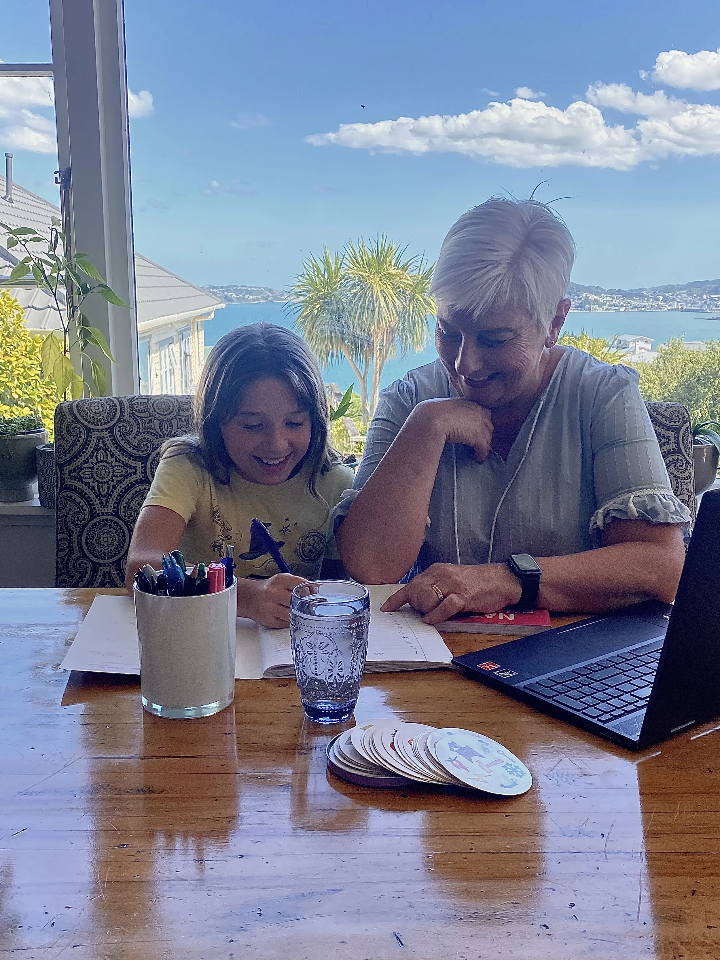 Tutor Marina Collott sits with a child, supporting them through their learning struggles.