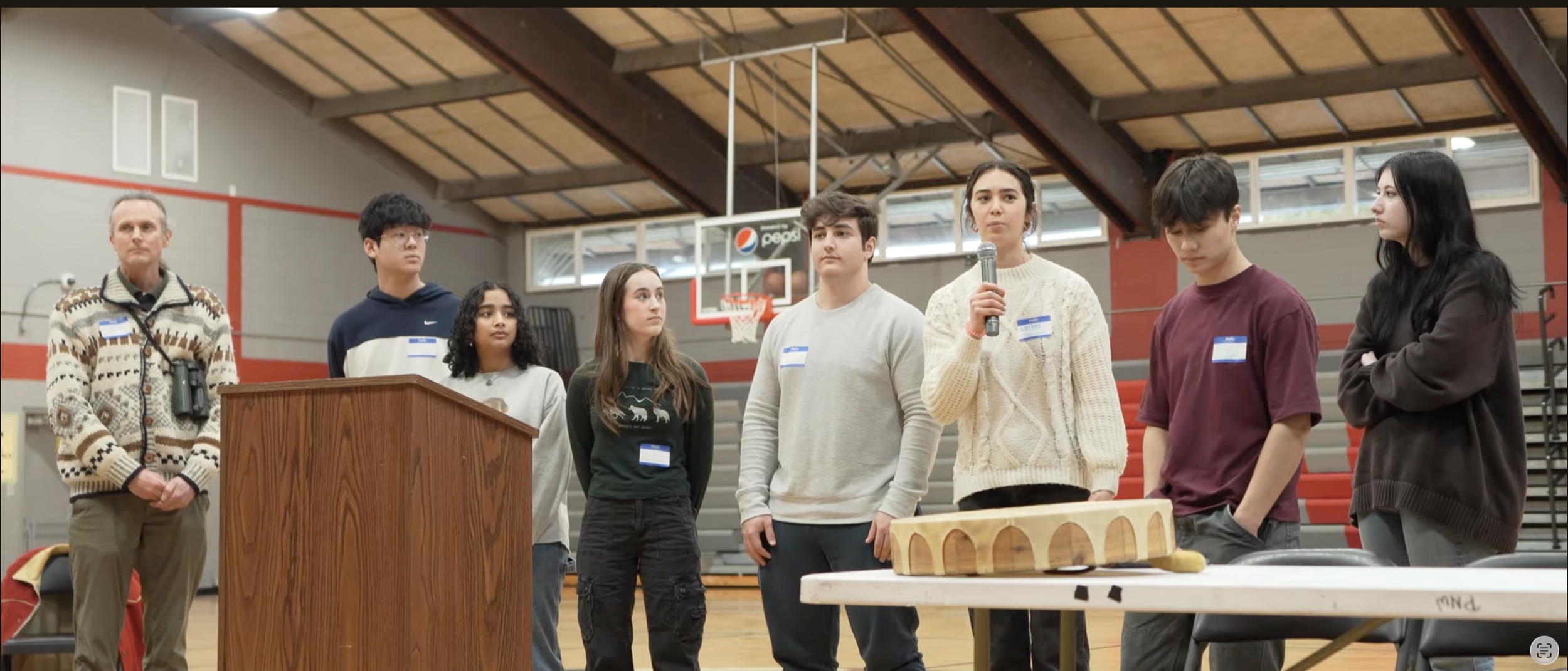 Members of the Timberline TREE Club talk during a wolf ceremony in Lapwai Idaho, in this scene from the documentary Children of the Wolves.
