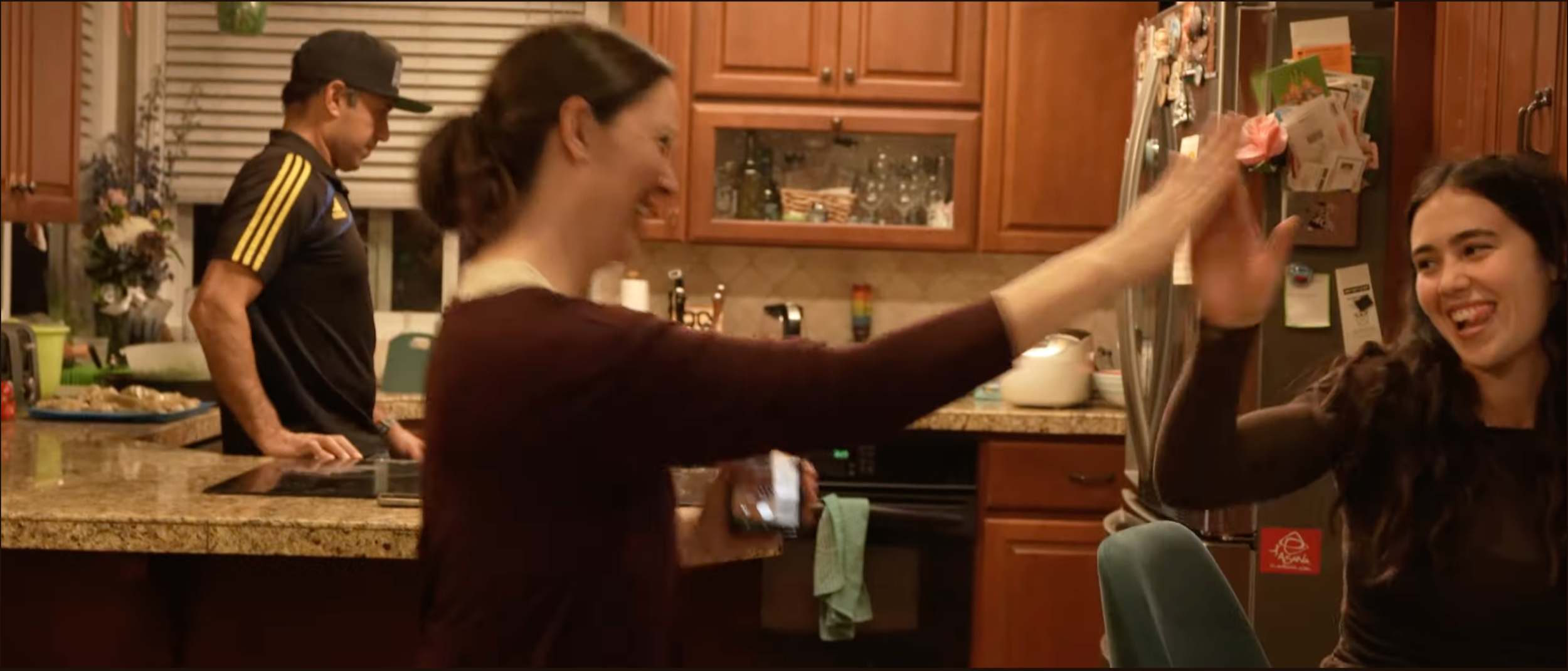 High School student Sasha Truax and her mom celebrate a college acceptance email in this scene from Children of the Wolves.
