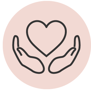 Two hands holding a heart on a pink background.